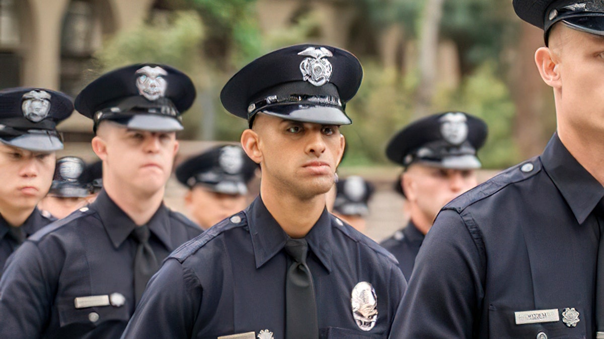 LAPD Officer Fernando Arroyos lined up with other police
