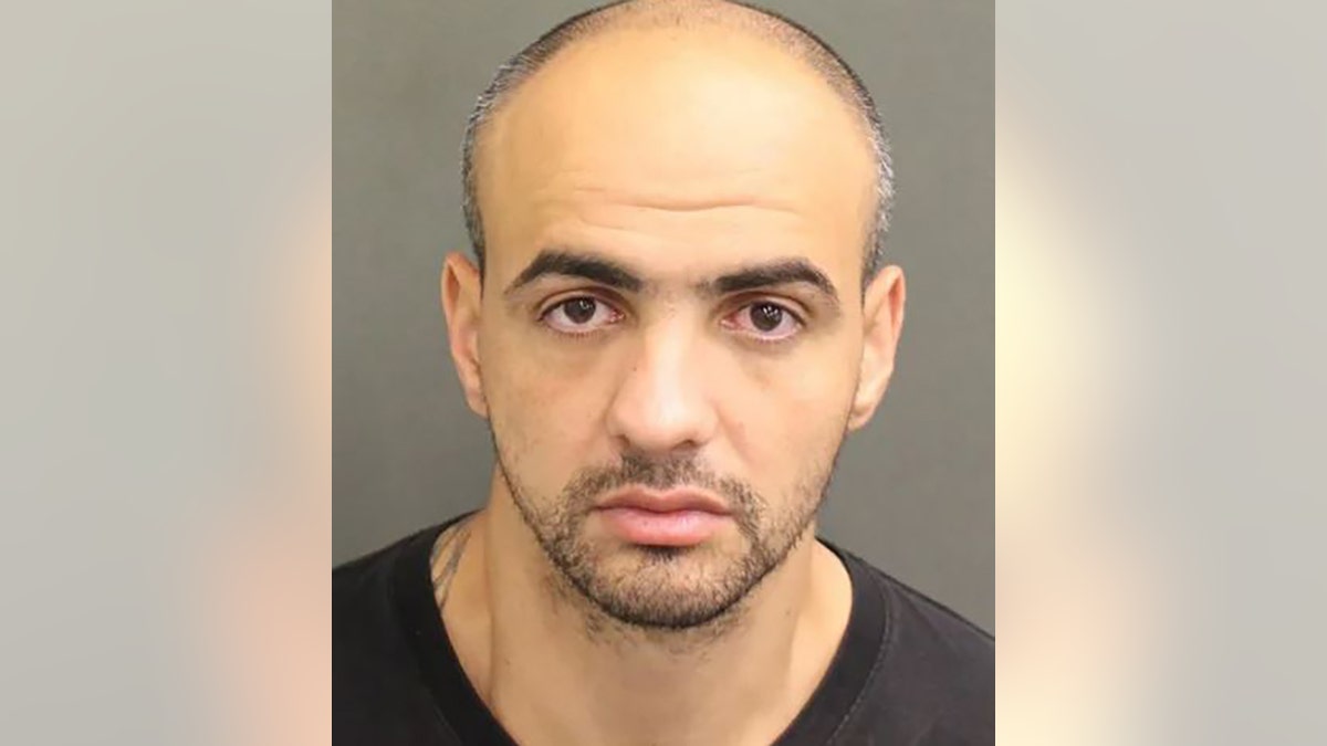 Alexander Acs, 33, was booked into the Orange County Jail on a first-degree murder charge