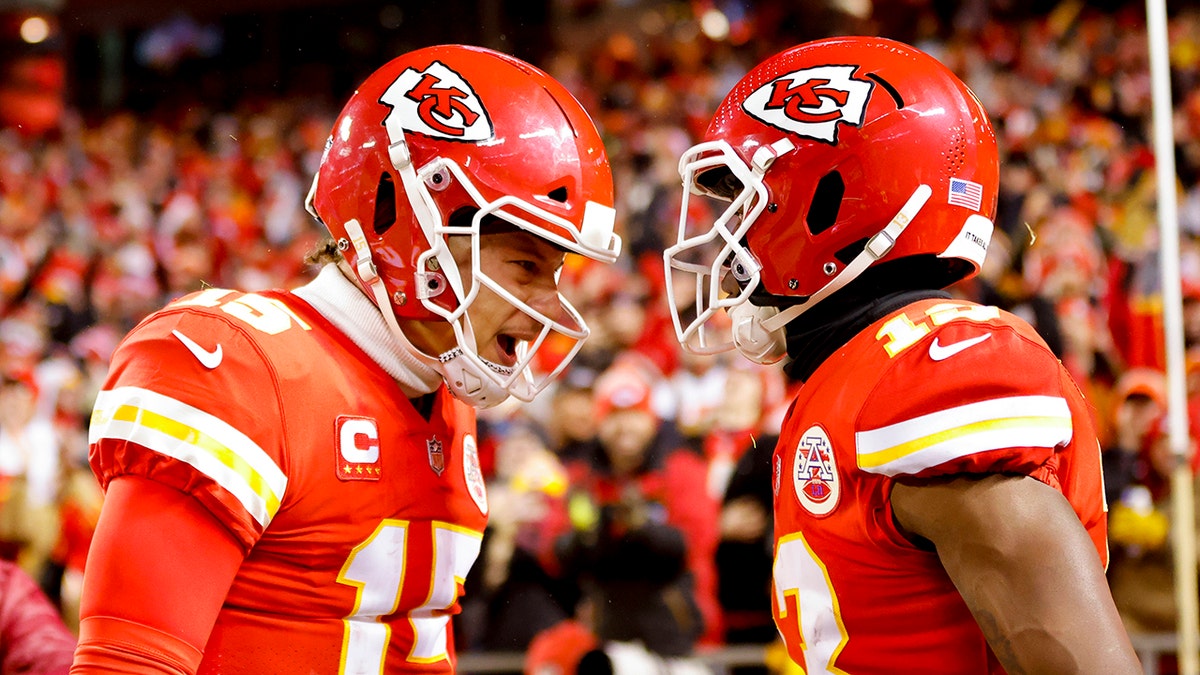 Byron Pringle (13) of the Kansas City Chiefs celebrates scoring a touchdown with teammate Patrick Mahomes (15) in the second quarter of the game against the Pittsburgh Steelers in the NFC wild-card playoff game at Arrowhead Stadium on Jan. 16, 2022, in Kansas City, Missouri.