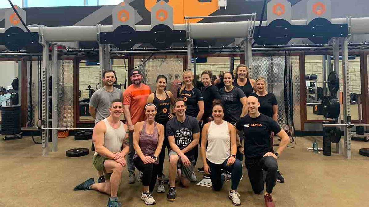 Osland is pictured with her Life Time Alpha Strong group, which she joined in February last year.