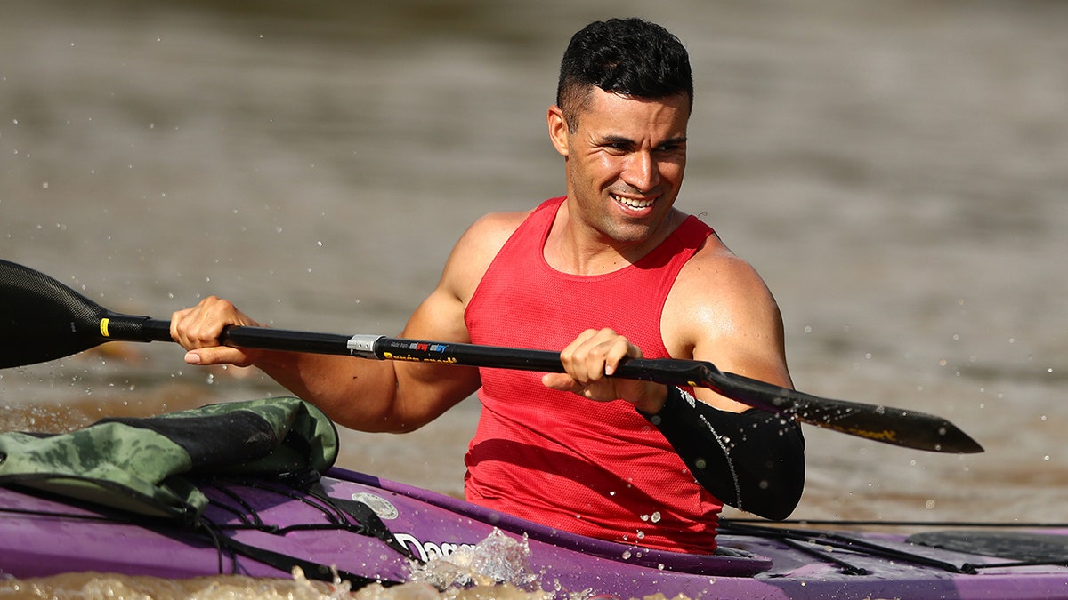 Pita Taufatofua trains at Jindalee Boat Ramp on December 23, 2021 in Brisbane, Australia.