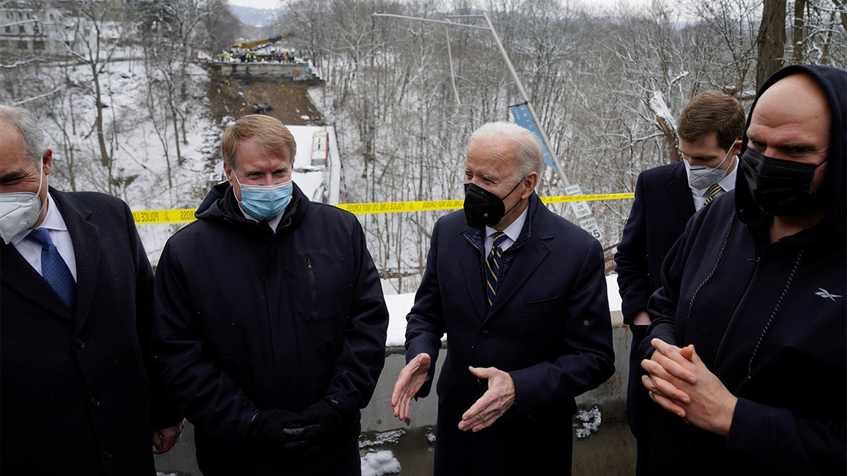 President Biden visits the site where the Fern Hollow Bridge bridge collapsed Friday, Jan. 28, 2022, in Pittsburgh's East End. (AP Photo/Andrew Harnik)