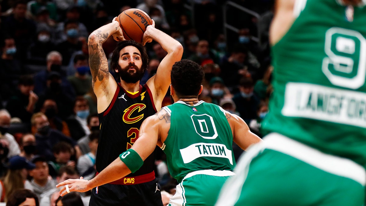 Ricky Rubio #3 of the Cleveland Cavaliers looks to pass as Jayson Tatum #0 of the Boston Celtics defends during the second quarter of the game at TD Garden on December 22, 2021 in Boston, Massachusetts.