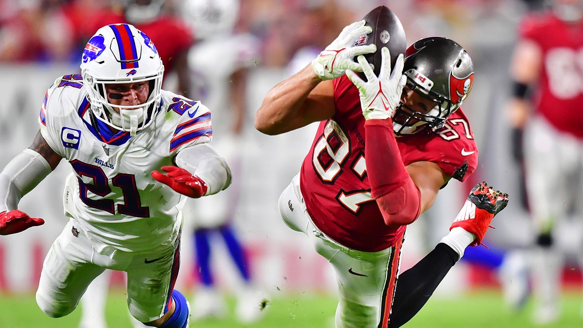 Rob Gronkowski (87) of the Tampa Bay Buccaneers attempts to catch a ball thrown by Tom Brady during the second half against the Buffalo Bills at Raymond James Stadium on Dec. 12, 2021, in Tampa, Florida.