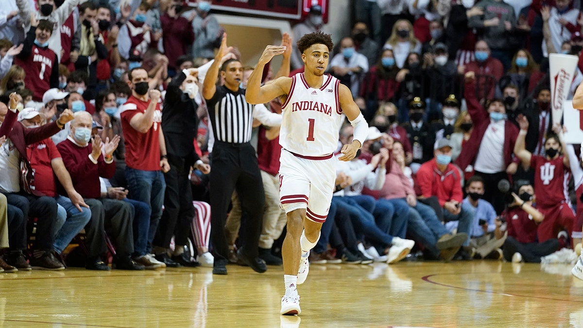 Indiana's Rob Phinisee (1) reacts after hitting a three-point basket during the first half of an NCAA college basketball game against Purdue, Thursday, Jan. 20, 2022, in Bloomington, Ind.