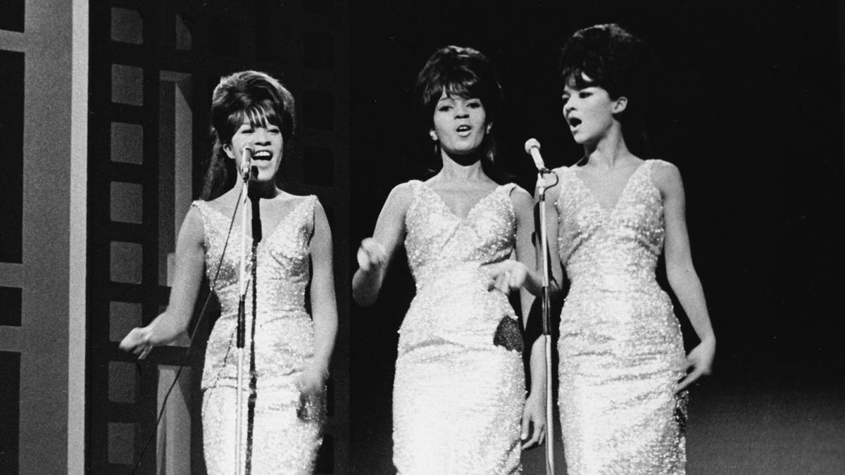 The Ronettes perform on stage in 1963.