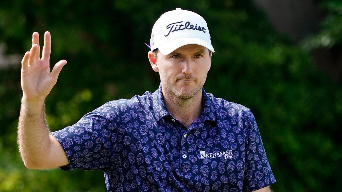 Russell Henley waves after making an eagle on the ninth hole during the second round of the Sony Open golf tournament, Friday, Jan. 14, 2022, at Waialae Country Club in Honolulu.