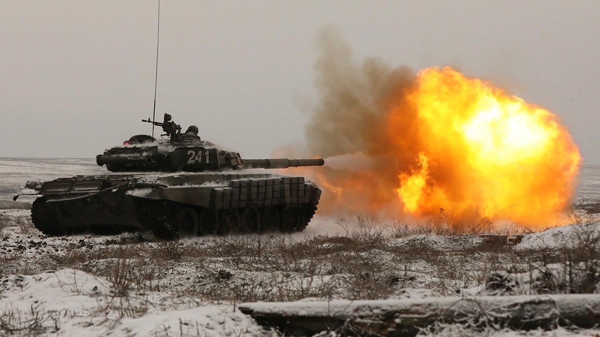 A Russian tank T-72B3 fires as troops take part in drills at the Kadamovskiy firing range in the Rostov region in southern Russia, Wednesday, Jan. 12, 2022.