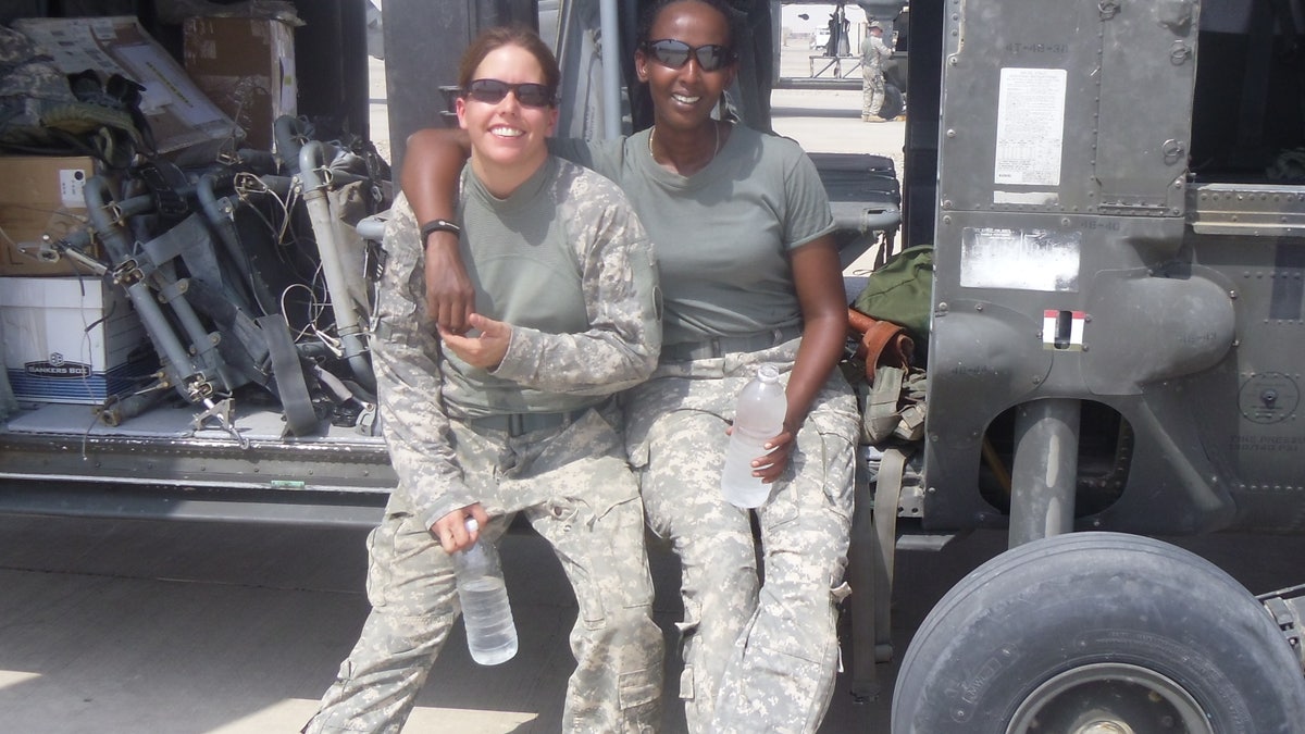 US Soldiers sit on vehicle on deployment