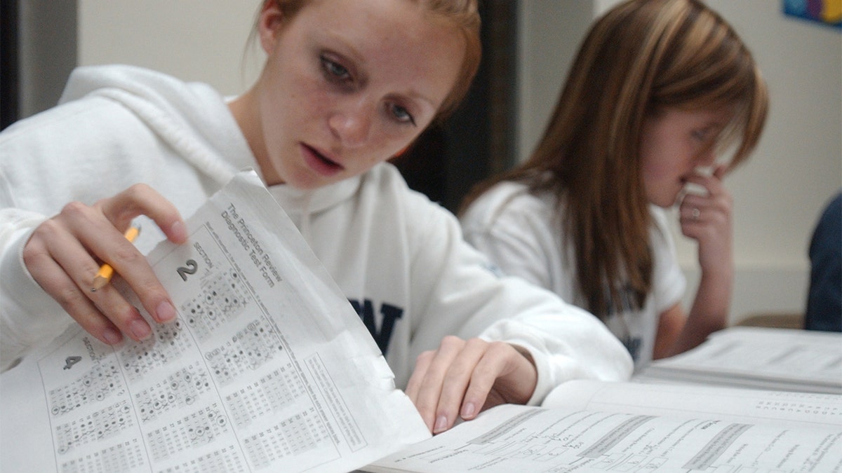 Nicole M. McCoy, 17, left, of Wernersville, and Kerri B. Orzechowski, 17, of Sinking Spring, taking a SAT prep course in Pennsylvania.