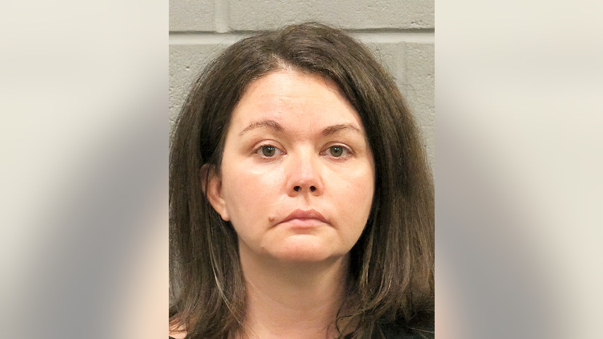 Sarah Beam, 42, is charged with child endangerment after her COVID-19 positive teen son was found in the trunk of her car at a Houston-area testing site.