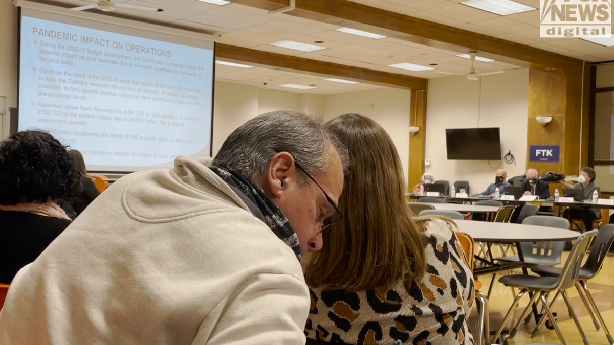 Parents attending a local school board meeting.