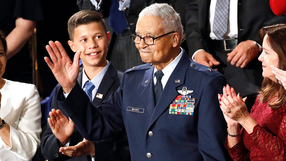 Tuskegee airman Charles McGee and his great grandson Iain Lanphier react as President Donald Trump delivers his State of the Union address to a joint session of Congress on Capitol Hill in Washington, Tuesday, Feb. 4, 2020. McGee, one of the last surviving Tuskegee Airmen who flew 409 fighter combat missions over three wars, died Sunday, Jan. 16, 2022. He was 102. (AP Photo/Patrick Semansky, File)