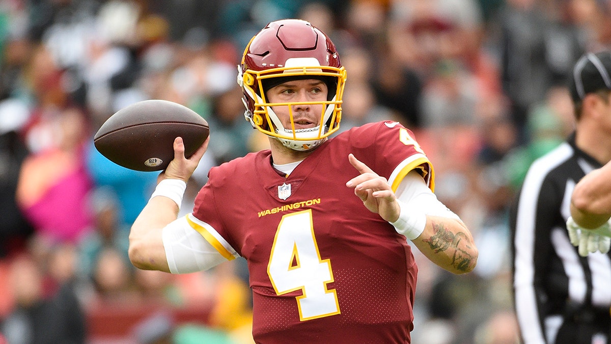 Washington Football Team quarterback Taylor Heinicke (4) passing the ball against the Philadelphia Eagles during the first half of an NFL football game, Sunday, Jan. 2, 2022, in Landover, Maryland.