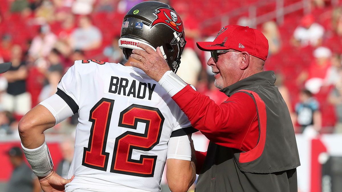  Tampa Bay Buccaneers Quarterback Tom Brady (12) greets Head Coach Bruce Arians before the regular season game between the Carolina Panthers and the Tampa Bay Buccaneers on January 9, 2022 at Raymond James Stadium in Tampa, Florida.