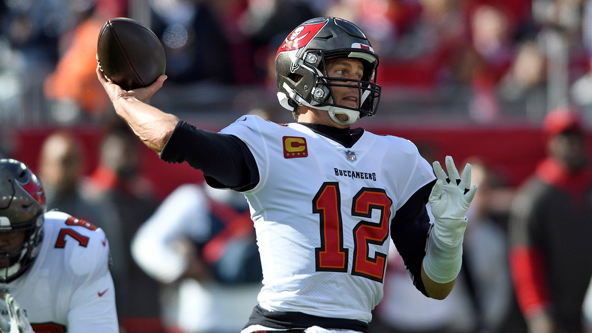 Tampa Bay Buccaneers quarterback Tom Brady (12) throws a pass during the first half of an NFL divisional round playoff football game against the Los Angeles Rams Sunday, Jan. 23, 2022, in Tampa, Fla.