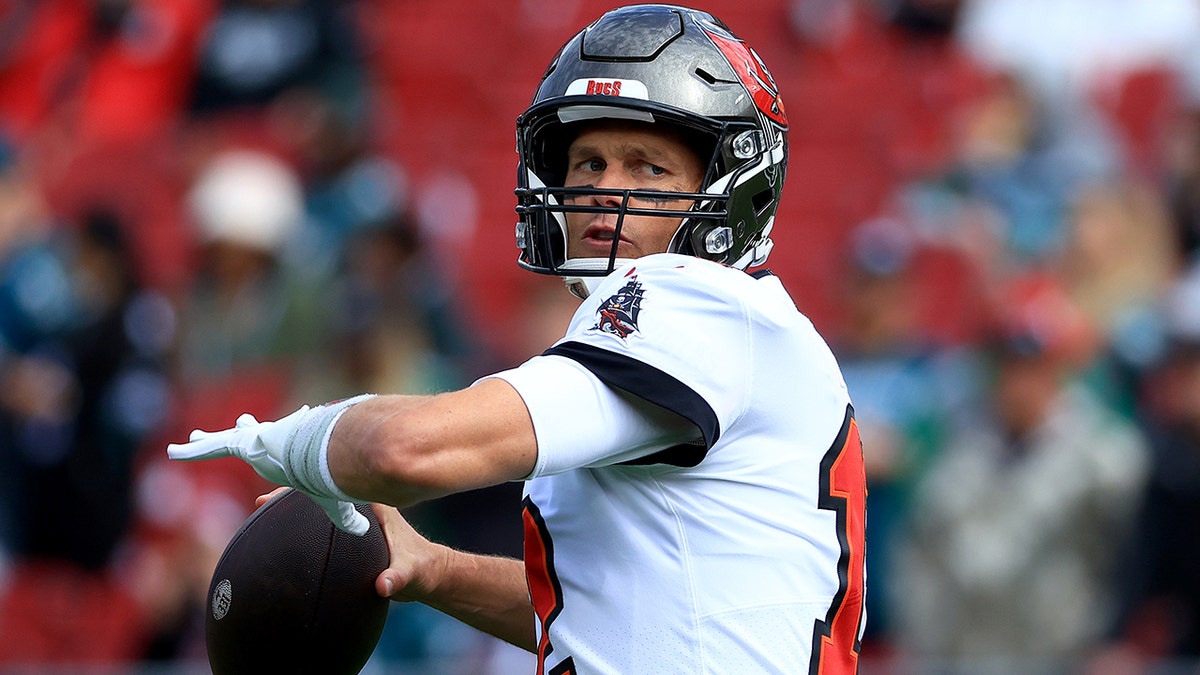 Tom Brady of the Tampa Bay Buccaneers warms up prior to the NFC Wild Card Playoff game against the Philadelphia Eagles at Raymond James Stadium on Jan. 16, 2022, in Tampa, Florida.