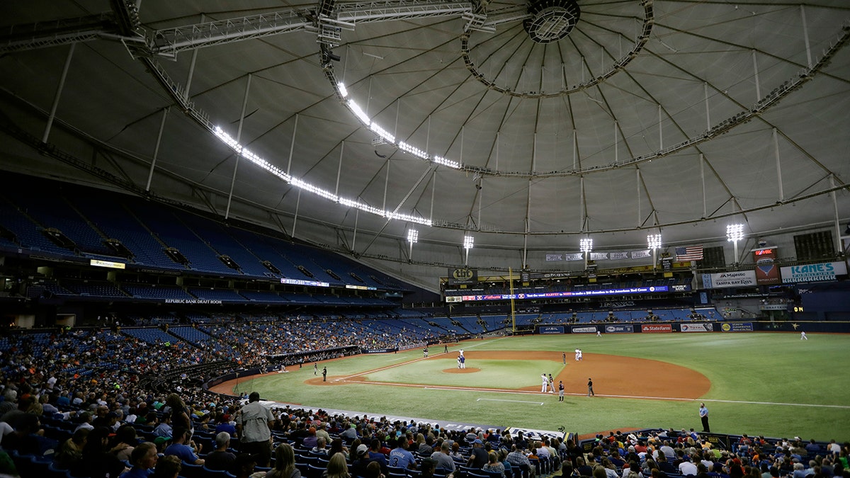 FILE - The Houston Astros play the Texas Rangers during the third inning of a baseball game at Tropicana Field in St. Petersburg, Fla., Aug. 29, 2017.