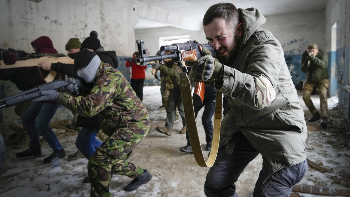 Local residents train close to Kyiv, Ukraine, on Sunday.