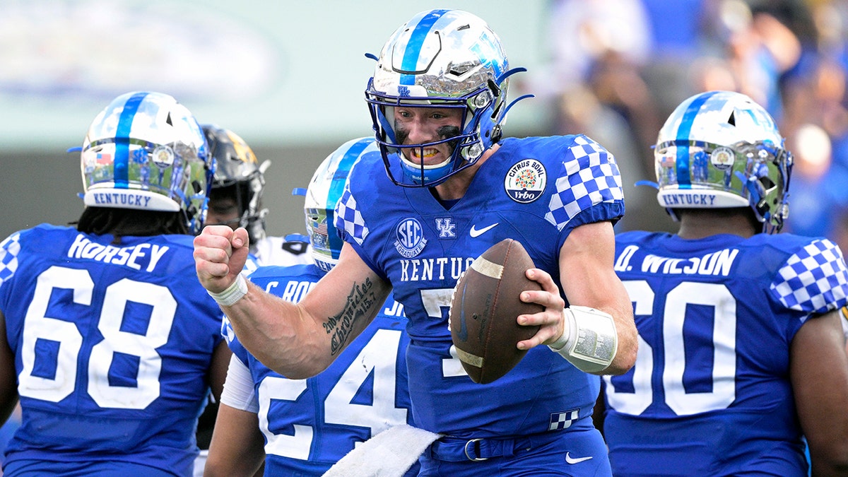 Kentucky quarterback Will Levis (7) celebrates after taking the final snap of the Citrus Bowl NCAA college football game win against Iowa, Saturday, Jan. 1, 2022, in Orlando, Fla.