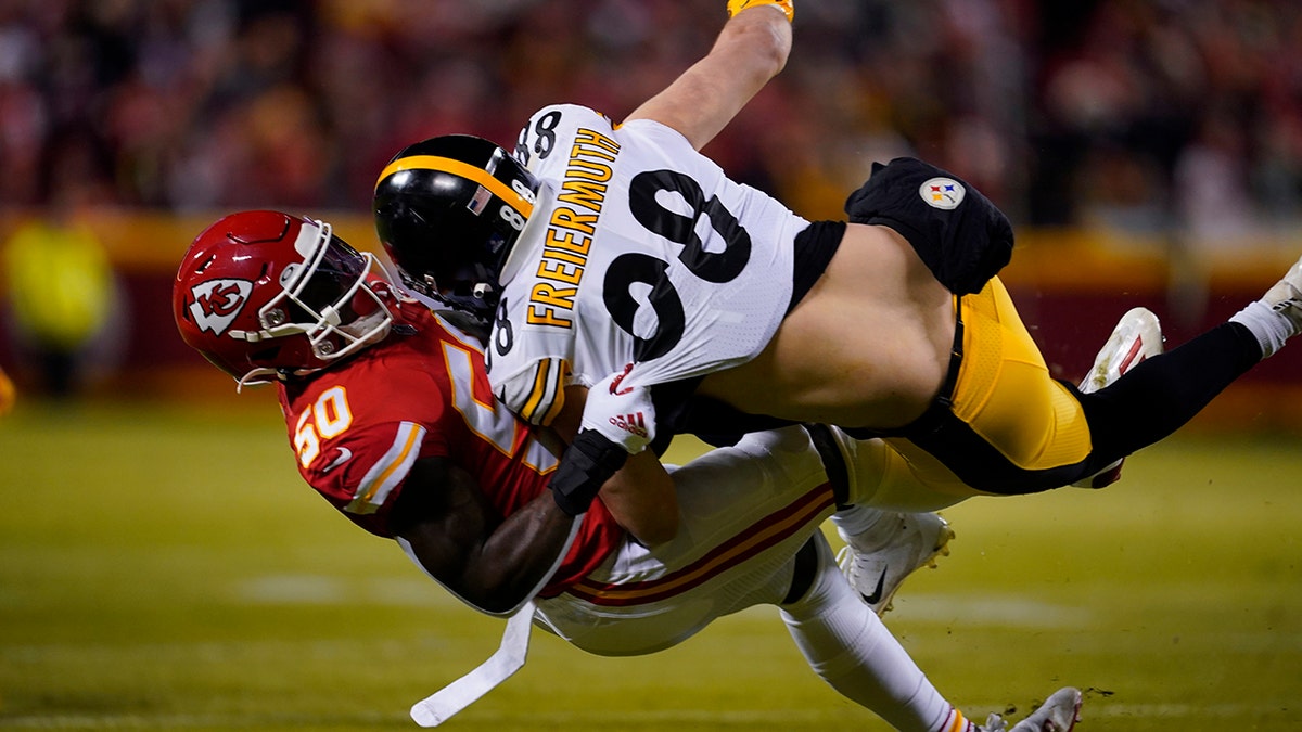 Pittsburgh Steelers tight end Pat Freiermuth (88) is tackled by Kansas City Chiefs middle linebacker Willie Gay Jr. (50) during the first half of an NFL wild-card playoff football game, Sunday, Jan. 16, 2022, in Kansas City, Missouri.