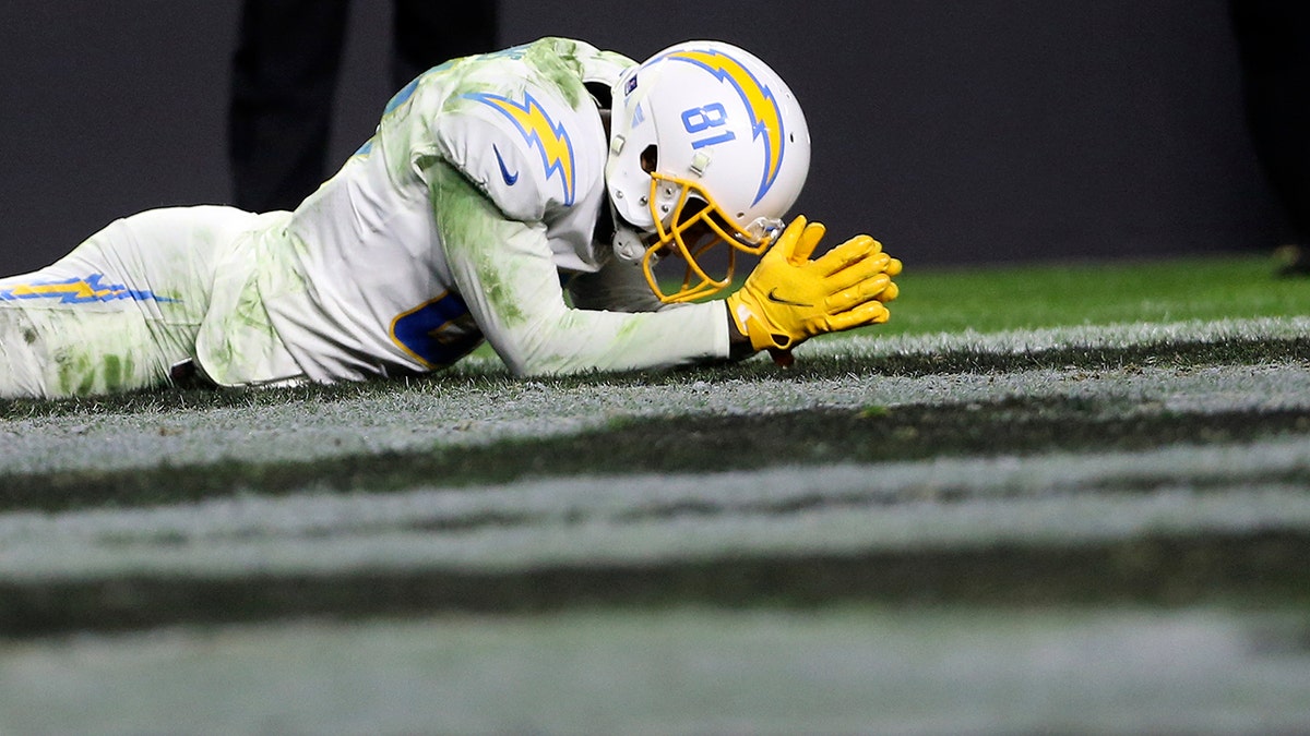 Los Angeles Chargers wide receiver Mike Williams (81) reacts after missing an attempted touchdown catch against the Las Vegas Raiders during overtime of an NFL football game, Sunday, Jan. 9, 2022, in Las Vegas.