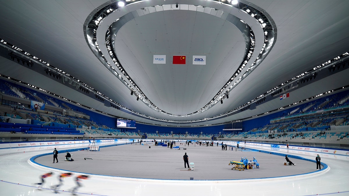 Skaters compete during the Speed Skating China Open, a test event for the 2022 Winter Olympics, at the National Speed Skating Oval in Beijing, Saturday, Oct. 9, 2021. 