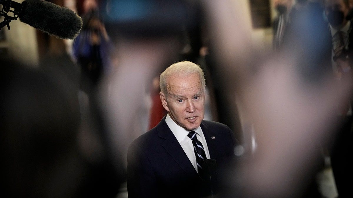 President Biden speaks to reporters after a meeting with Senate Democrats in the Russell Senate Office Building on Capitol Hill on Jan. 13, 2022, in Washington.