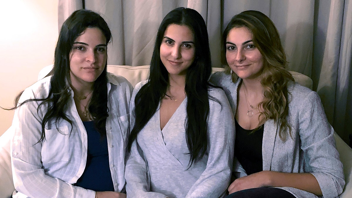 Three of Amer Fakhoury's four daughters, from left, Guila, Macy and Zoya, Fakhoury, gather Nov. 5, 2019, in Salem, New Hampshire. 