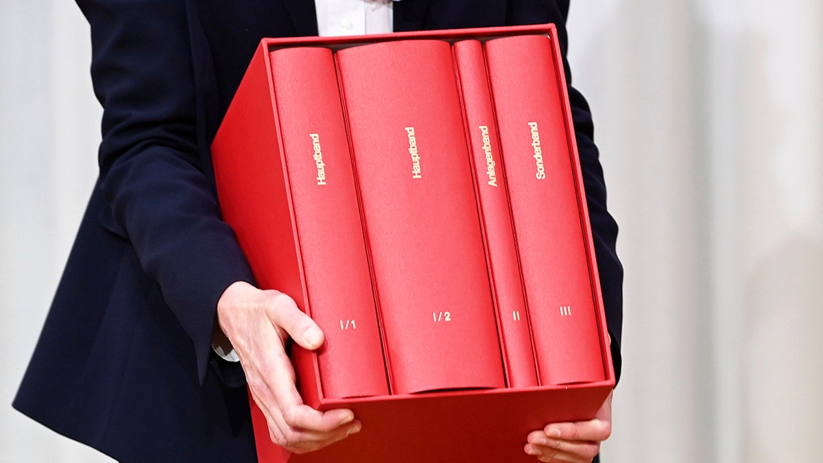 Stephanie Herrmann, head of office of the Archdiocese of Munich and Freising, holds the expert opinion on cases of sexual abuse in the Catholic Archdiocese of Munich and Freising after it was presented and handed over by the Munich law firm Westpfahl Spilker Wastl, Munich, Germany, Thursday, Jan. 20, 2022. 