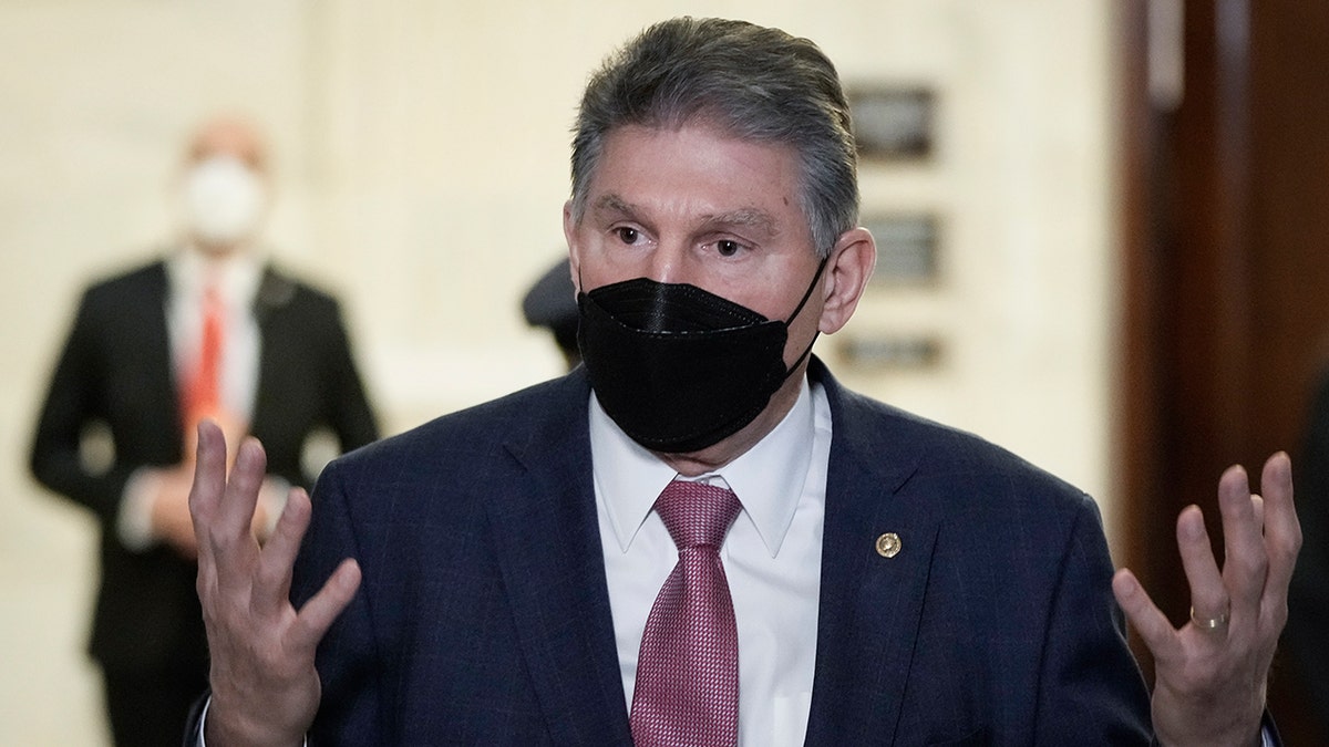 Sen. Joe Manchin, D-W.Va., speaks to reporters after a meeting with President Biden and Senate Democrats in the Russell Senate Office Building on Capitol Hill on Jan. 13, 2022, in Washington. 