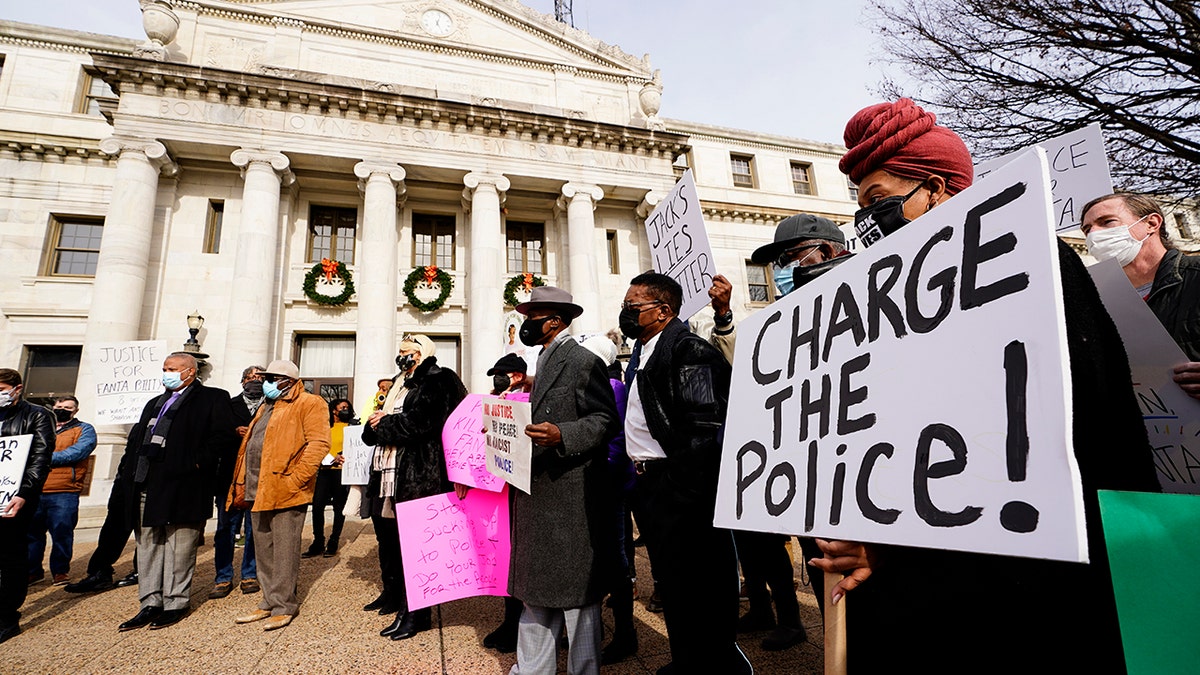 Protesters demonstrate calling for police accountability in the death of 8-year-old Fanta Bility who was shot outside a football game, at the Delaware County Courthouse in Media, Pa., Thursday, Jan. 13, 2022. 