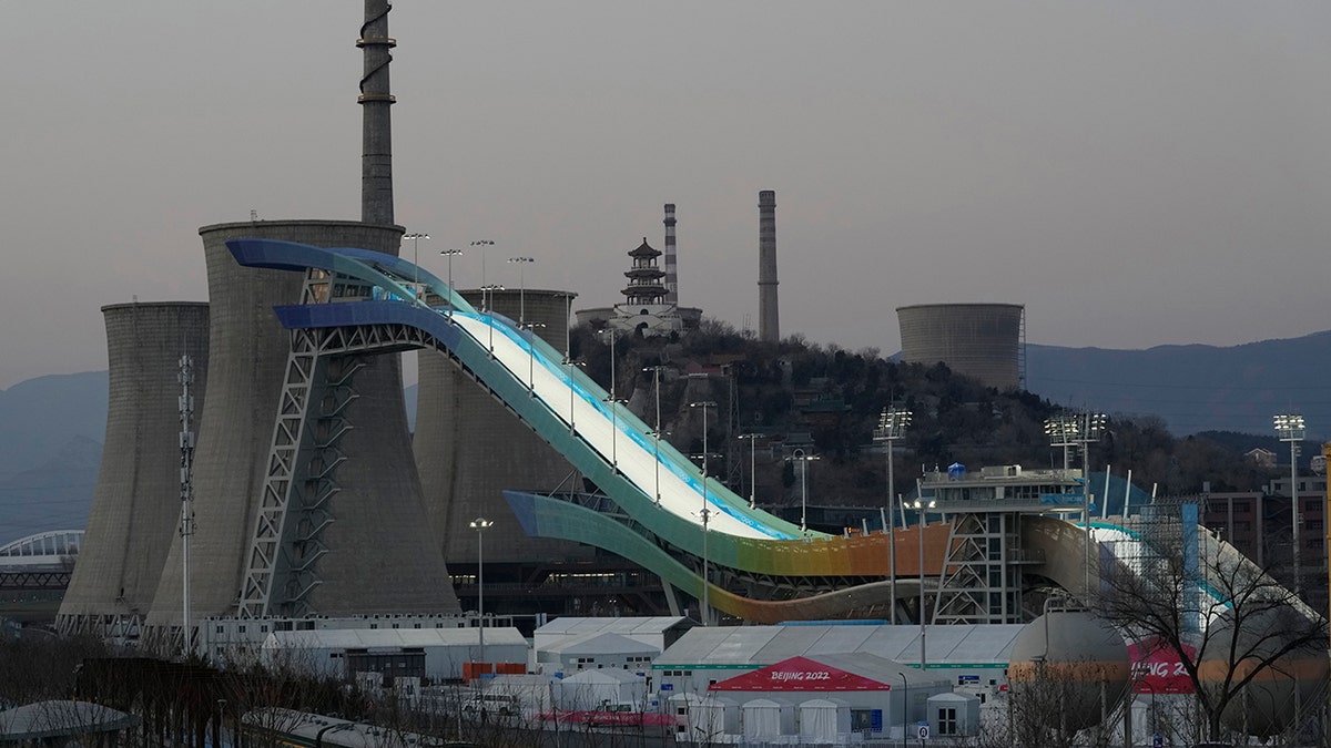 The Big Air Shougang course is illuminated at dusk in Beijing, China, Tuesday, Jan. 11, 2022. The venue will host the big air competition during the upcoming 2022 Beijing Winter Olympics. 