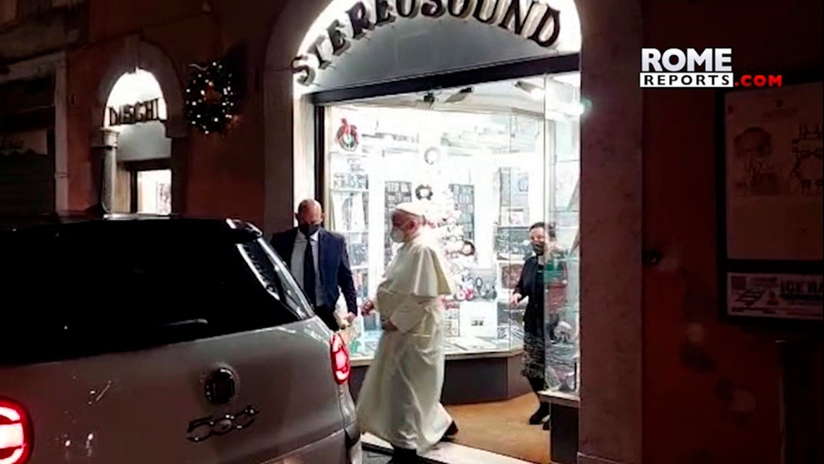 In this image from video made available by Javier Martinez Brocal of Rome Reports, Pope Francis leaves a record shop in Rome, Tuesday, Jan. 11, 2022. 