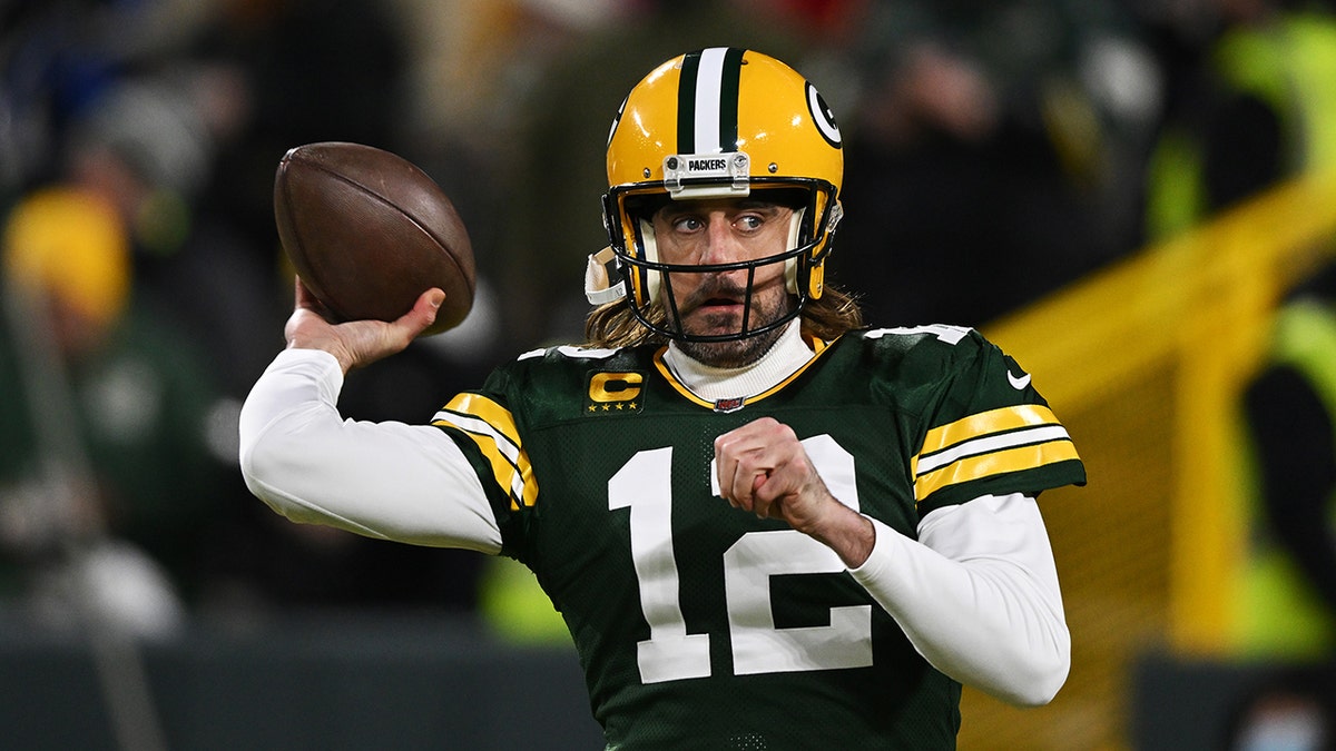 GREEN BAY, WISCONSIN - JANUARY 22:  Quarterback Aaron Rodgers #12 of the Green Bay Packers warms up prior to the NFC Divisional Playoff game against the San Francisco 49ers at Lambeau Field on January 22, 2022 in Green Bay, Wisconsin. (Photo by Quinn Harris/Getty Images)