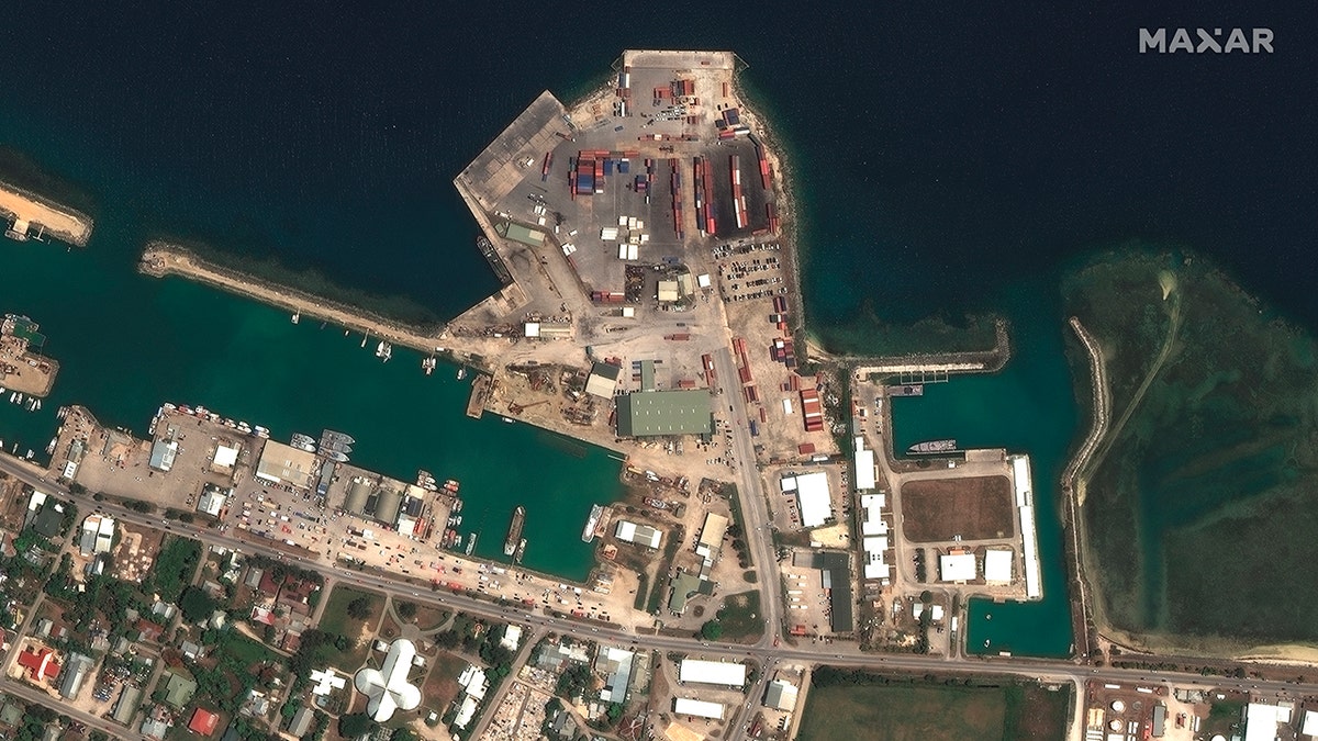 This satellite image provided by Maxar Technologies shows the main port facilities in Nuku’alofa, Tonga, on Dec. 29, 2021. 