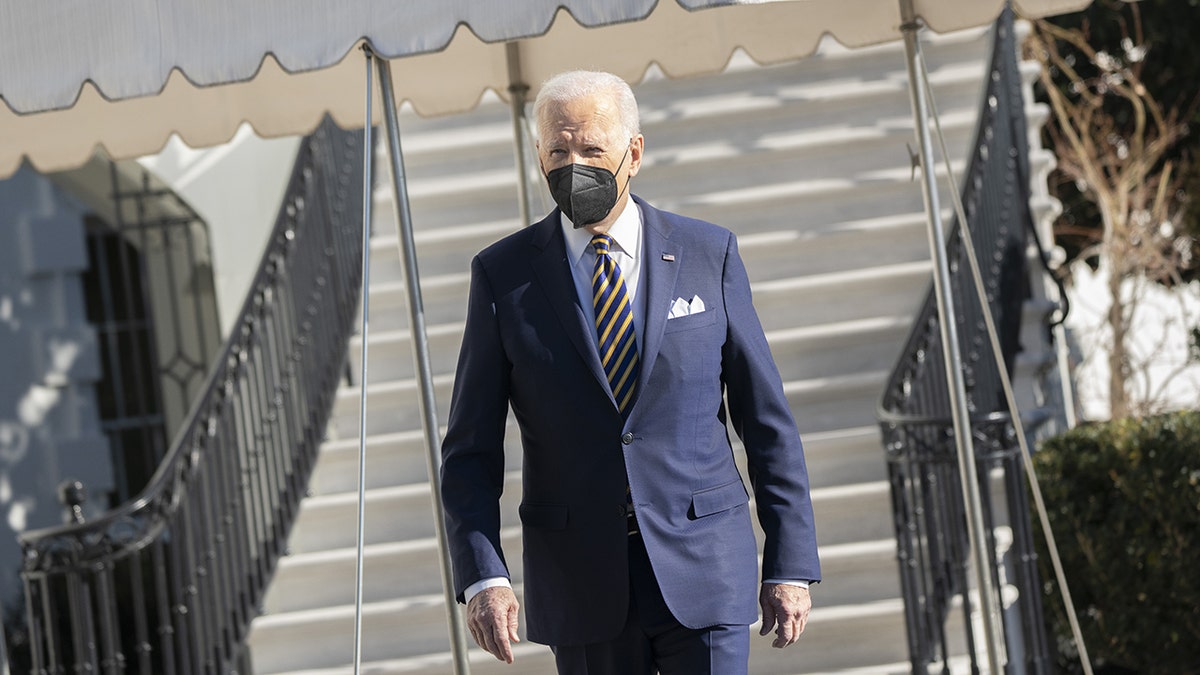 President Biden walks on the South Lawn of the White House before boarding Marine One on Tuesday, Jan. 11, 2022.