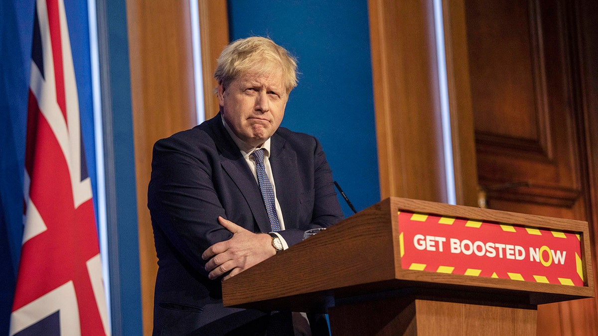 Britain's Prime Minister Boris Johnson pauses during a coronavirus media briefing in Downing Street, London, Tuesday, Jan. 4, 2022. 