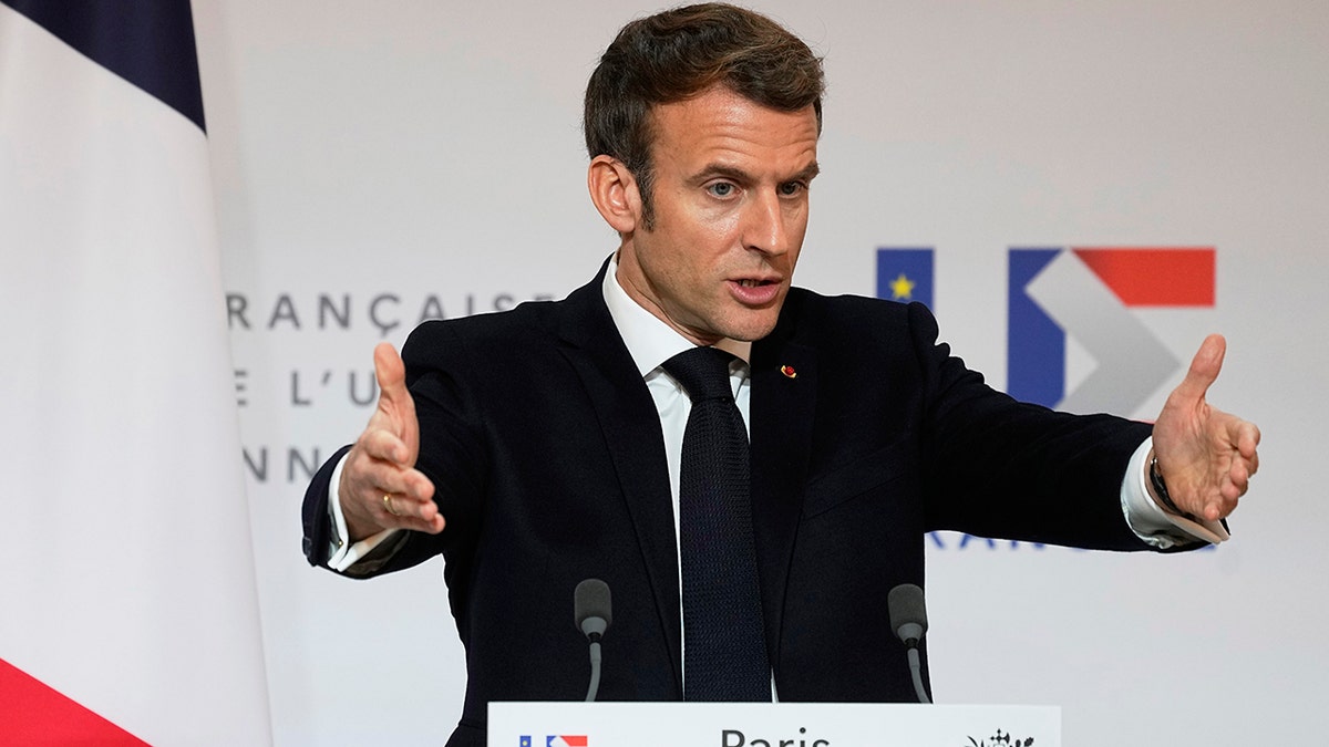 French President Emmanuel Macron speaks as he participates in a media conference with European Commission President Ursula von der Leyen after a meeting at the Elysee Palace in Paris, France, Friday, Jan. 7, 2022. 