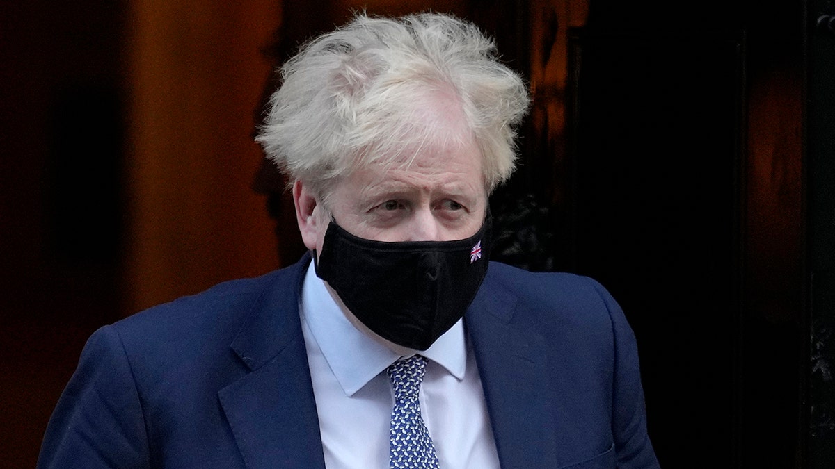 Britain's Prime Minister Boris Johnson leaves Downing Street to attend the weekly session of Prime Ministers Questions in London, Wednesday, Jan. 12, 2022. 