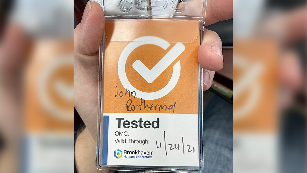 Orange badge that unvaccinated former Brookhaven engineer John Rothermel was told he should wear.