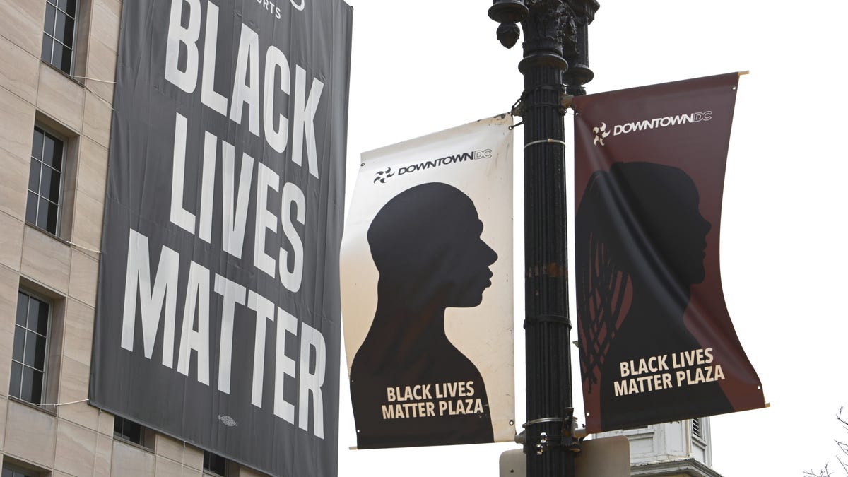 A 'Black Lives Matter' banner hangs in Washington, D.C. one year after George Floyd's death