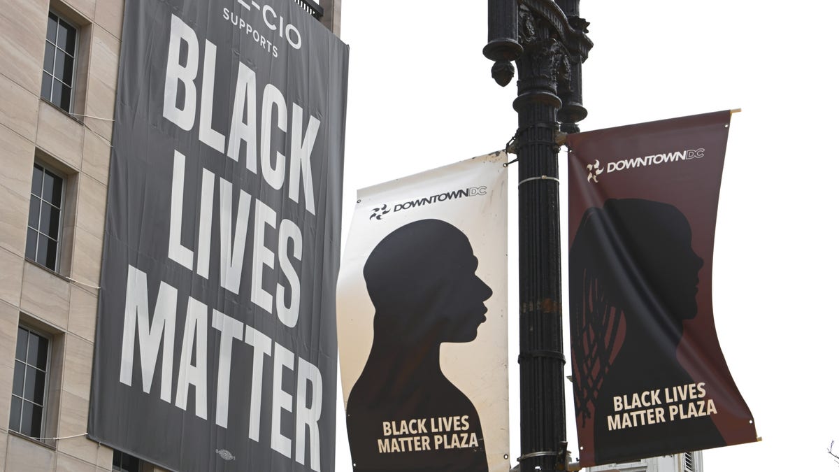 A 'Black Lives Matter' banner hangs in Washington, D.C. one year after George Floyd's death