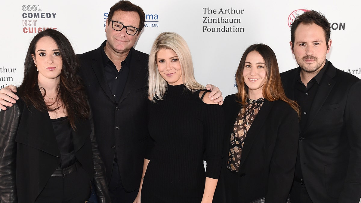 Bob Saget and Kelly Rizzo pose for a photo with Aubrey Saget, Lara Saget and guest as they attend Scleroderma Research Foundation's Cool Comedy - Hot Cuisine New York 2018 in New York City. 