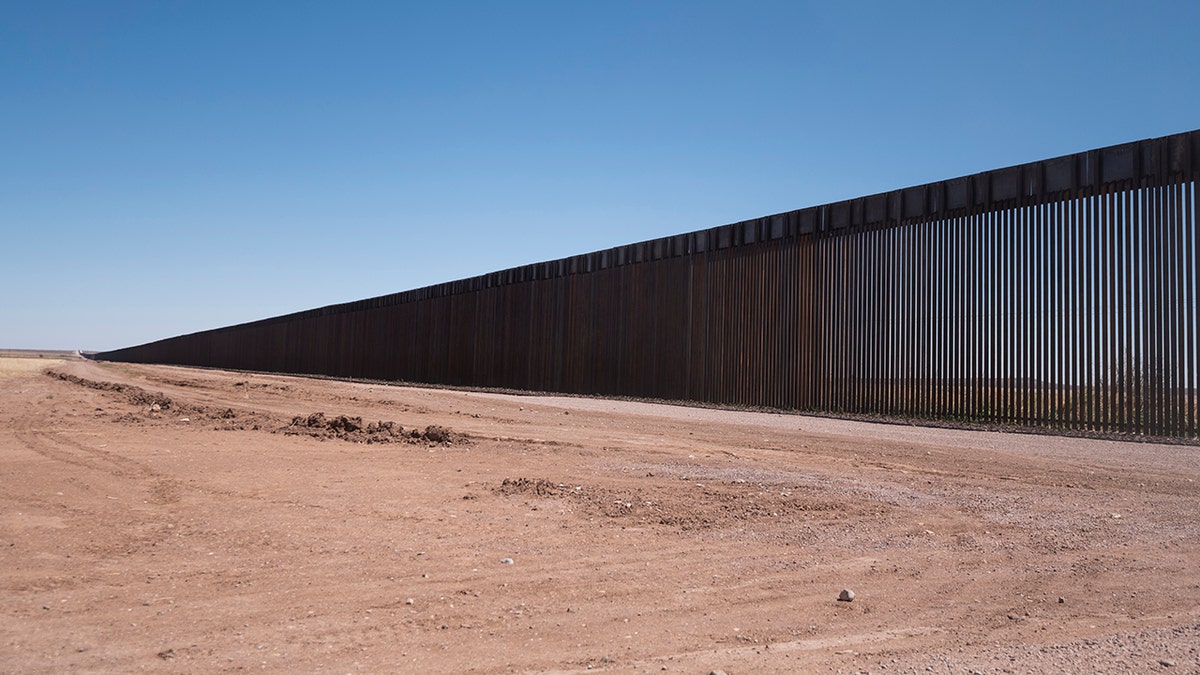 The border wall stretches along the U.S.-Mexico border on the Johnson Ranch near Columbus, New Mexico