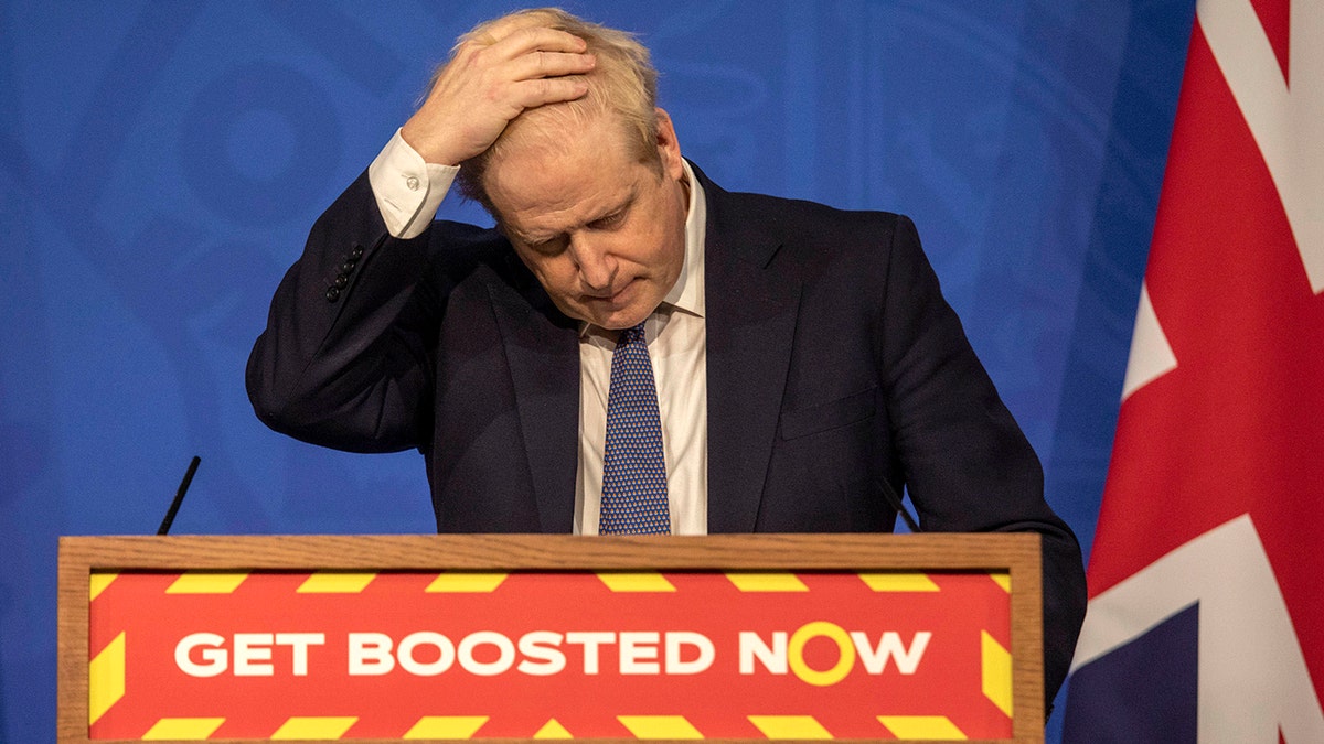 Britain's Prime Minister Boris Johnson gestures during a coronavirus media briefing in Downing Street, London, Tuesday, Jan. 4, 2022.