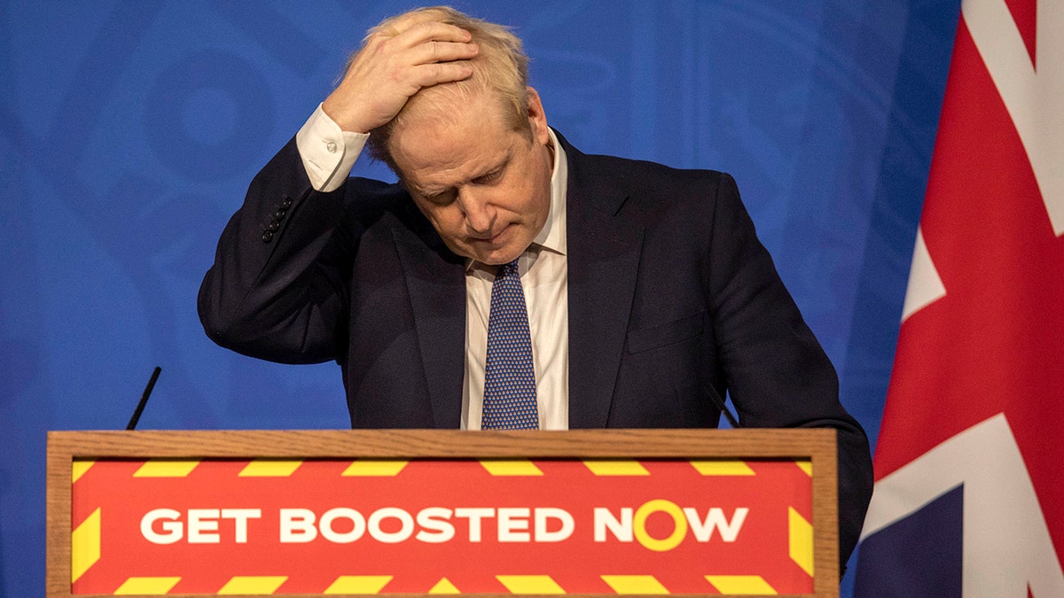 Britain's Prime Minister Boris Johnson gestures during a coronavirus media briefing in Downing Street, London, Tuesday, Jan. 4, 2022. 