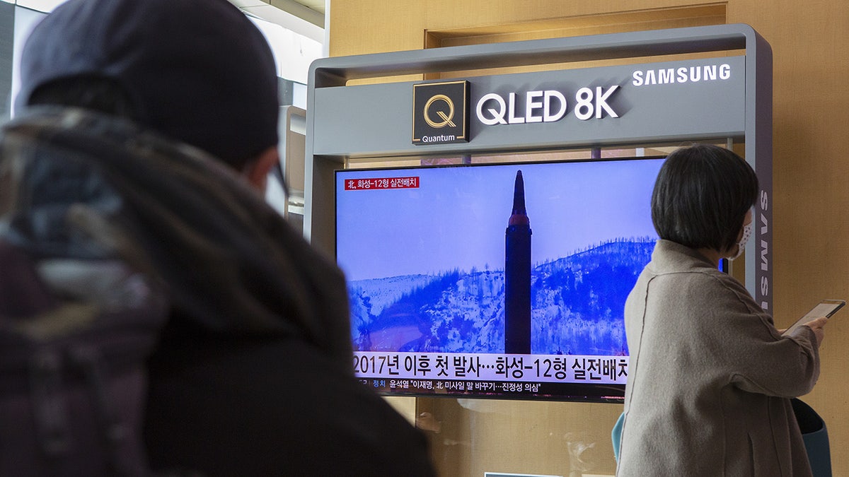 People watch the coverage of North Korea's latest missile launch in Seoul Station, South Korea on January 31, 2022. (Photo by Jong-Hyun Kim/Anadolu Agency via Getty Images)