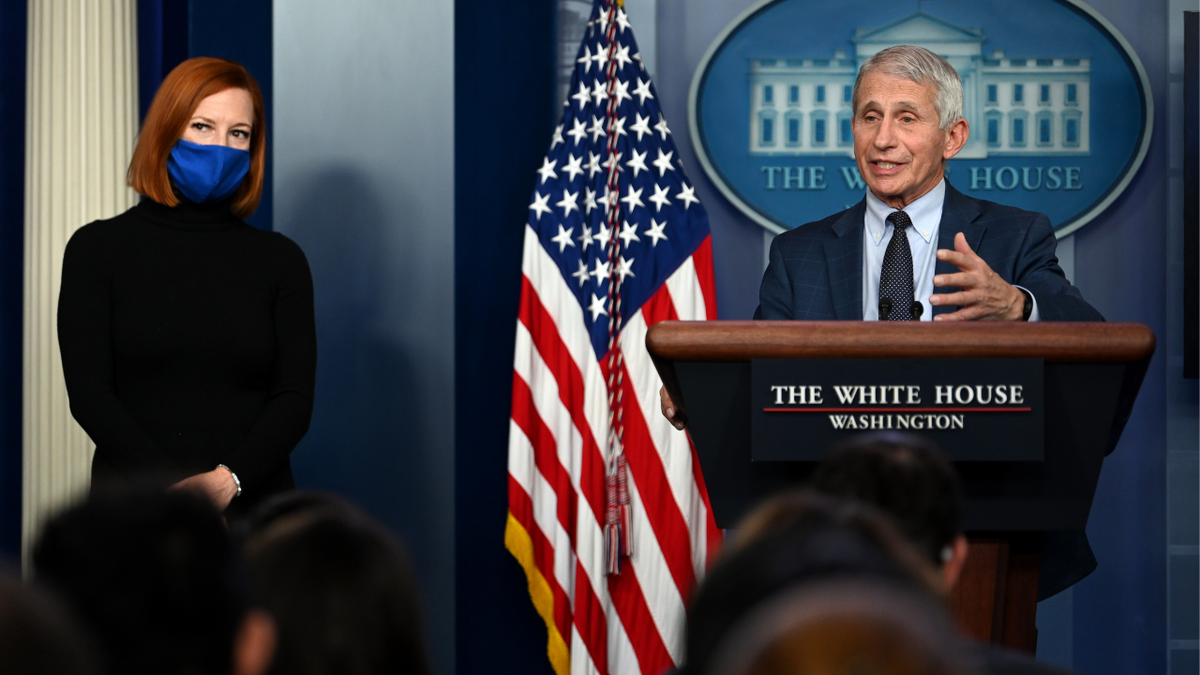 White House Press Secretary Jen Psaki (L) listens as director of the National Institute of Allergy and Infectious Diseases Anthony Fauci gives an update on the Omicron COVID-19 variant during the daily press briefing at the White House on December 1, 2021 in Washington, DC.