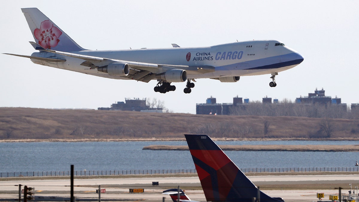  A China Airlines cargo jet lands at John F. Kennedy International Airport, Saturday, March 14, 2020, in New York. Verizon and AT&amp;T have rejected a request by the U.S. government to delay the rollout of next-generation wireless technology. 